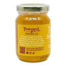 A jar of Powerful Pepper Company’s Pineapple Scotch Bonnett Chili Jam featuring a yellow label, this Caribbean-inspired jam is crafted from pineapples and Scotch Bonnet peppers sourced from the Bahamas. The label displays a QR code and website details.
