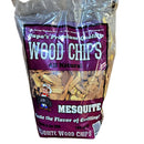 A clear plastic bag labeled Papa's Brand Mesquite Flavor Wood Chips from Papa's Grilling Products contains natural hardwood mesquite chips for BBQ smoking. The purple and white packaging features a cartoon chef at a grill.