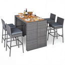 The DirectDeals Patio Acacia Wood Dining Set for Home features a gray wicker rectangular table and four high-backed chairs, perfect for outdoor entertaining with stylish place settings and drinks.