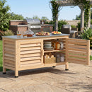 The DirectDeals Outdoor Storage Cabinet with Stainless Steel Countertop stands on a stone patio, storing dishes and condiments inside, with drinks and snacks on top. A grill and greenery are visible in the background.