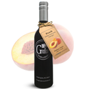 A bottle of Georgetown Olive Oil Co Peach White Balsamic, produced in Modena, Italy, featuring a gold tag and a peach graphic, is displayed in front of a halved peach on a white background. The label shows the Georgetown Olive Oil Co. brand name.