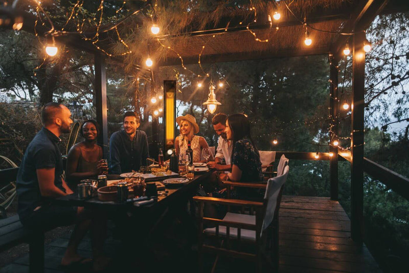 Phantom Freestanding Outdoor Electric Infrared Heater at DDR BBQ Supply in use on patio in evening