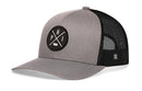The Haka Hat Philadelphia Trucker Hat | Gray-Black PHI X Snapback features a gray and black design, curved brim, mesh back, and a front round patch with white crossed lines, "P" and "H" letters, plus a small state outline—classic snapback style.