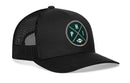 The Haka Hat Philadelphia Trucker Hat is a black mesh snapback with a curved brim and a round green and black patch on the front featuring crossed lines, the letters PHI, and a small football.