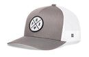 The Haka Hat Phoenix Trucker Hat in gray and white features a mesh back, curved brim, and a round PHX cactus patch—paying tribute to Phoenix, Arizona. This structured snapback makes a standout statement from the Haka Hat brand.