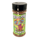A clear spice jar labeled "Powerful Pepper Powerful Pepper Flakes" from the Powerful Pepper Company features a colorful, cartoonish design with two blue dragons and chili peppers on a green background. Perfect for adding heat to any dish, this chili pepper blend comes in a bottle with a black lid.