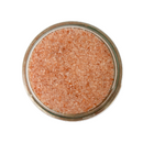 Top view of a glass jar filled with SALTOPIA Pink Himalayan Fine Salt 3lbs by SALTOPIA Infused Sea Salts, isolated on a white background.