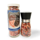 The SALTOPIA Infused Sea Salts Pink Himalayan & Gourmet Peppercorn Grinder Set features a jar with a blue label highlighting the vibrant mix, and a matching grinder with a black and silver top filled with the same blend.