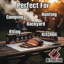 Sliced barbecue meat on a Butcher BBQ Plastic Disposable Cutting Board atop a wooden table, with smoke and people in the background. Text: Perfect for Camping, Hunting, Backyard, RVing, Kitchen. Butcher BBQ logo at bottom right.