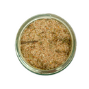 A glass jar of SALTOPIA Infused Sea Salts' Saltopia Best Poultry Salt: POLITE POULTRY, featuring coarse pinkish salt and visible dried herbs, is seen from above on a white background.