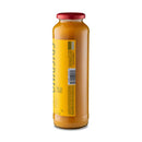 A tall glass bottle with a red cap contains golden yellow tomato sauce, identified as Taycte Famiglia Crispino Yellow Tomato Sauce Starter — Calabrian Pomodori Gialli by Taycte. The partially visible yellow label displays a barcode and some text, while the bottle is photographed against a white background, hinting at the signature Calabrian sweetness inside.