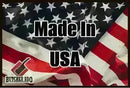 Made in USA“ text over a waving American flag, with the Butcher BBQ logo in the corner, and a subtle reference to quality meat trimming on a Butcher BBQ Disposable Cutting Board 18″ x 24″ (30 Count).