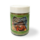A 4.5 oz jar of SALTOPIA Infused Sea Salts Best Poultry Salt: POLITE POULTRY features a green label with roast chicken imagery, a white lid, and highlights delicious herbs for perfect poultry seasoning.