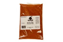 A sealed plastic bag of Butcher BBQ Premium Barbecue Rub by Butcher BBQ, labeled with product info and a barcode, containing a vibrant reddish-brown BBQ seasoning and spice blend.