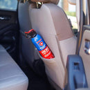 A Prepared Hero Fire Spray by Prepared Hero, ideal for kitchen fire safety, is stored in the back pocket of a beige fabric front car seat inside the vehicle.