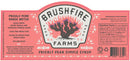 A pink label for Brushfire Farms Prickly Pear Simple Syrup, featuring a vibrant illustration of prickly pear cactus, ingredients list, nutrition facts, instructions for making the perfect prickly pear margarita, and company information highlighting Brushfire Farms’ use of authentic South Texas prickly pear.