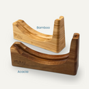 The NULU Knife and Dock Bundle from NULU Inc. features two elegant wooden docks—one crafted from lighter bamboo, the other from richly toned acacia—each engraved with “NULU.” These curved stands offer sophisticated countertop storage for your NULU knife or ergonomic kitchen knife with a practical vertical slot at one end, blending functionality with refined design.