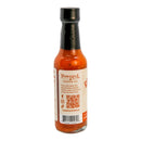 A bottle of Powerful Pepper Company Smoked Mango Habanero Hot Sauce features a black cap, vibrant orange-red sauce inside, and a label with text, a QR code, and a barcode on the back. Made with fiery Caribbean red habaneros and sweet Georgia Vidalia onions, this hot sauce from Powerful Pepper Company delivers bold flavor in every drop.
