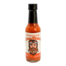 A bottle of Powerful Pepper Company’s Powerful Pepper Smoked Mango Habanero Hot Sauce features a label with an illustrated bearded man in aviator goggles. Inside, the vibrant orange-red sauce is crafted from fruity Caribbean red habaneros and sweet Georgia Vidalia onions, creating a bold and distinctive flavor.