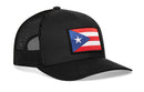 The Haka Hat Puerto Rico Flag Trucker Hat is a black PR snapback with a mesh back and features a Puerto Rico flag patch on the front.