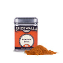 A tin of Spicewalla Pumpkin Spice sits beside a small mound of the aromatic blend, perfect for all your fall baking needs, against a white background.