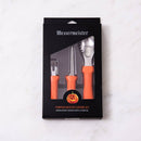 The Messermeister Pumpkin Carving Set - 3 Piece features bright orange handles and includes a scraper, sawtooth carver, and etching tool—perfect Halloween tools. Comes in black packaging with a clear window for easy viewing.