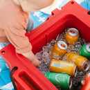 Red 25 QT cooler by Bison filled with ice and colorful sparkling water cans with a baby reaching in.
