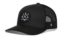 The Haka Hat Raleigh Trucker Hat | Black RAL X Snapback is a black 5-panel trucker hat with a mesh back and a front round patch showing intersecting lines, the letters RAL, and a small fish graphic.