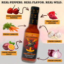 A bottle of Elijah's Xtreme Ranchers Revenge (Ghost Pepper) hot sauce is surrounded by labeled images of fresh habanero peppers, ghost peppers, carrots, garlic, onions, and passion fruit on a tan background with bold text at the top—highlighting the fiery kick of this Elijah's Xtreme ghost pepper hot sauce.