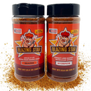 The Blazing Star BBQ Blazing Bundle includes two bottles of Blazing Star BBQ seasoning: Carolina Reaper and Scorpion Pepper. Each bottle features a pig mascot, bold red and orange labels, and icons highlighting that they are veteran-owned and gluten-free. Spices are scattered at the base of the bottles, emphasizing their robust flavor. This fiery BBQ spice bundle is perfect for those who crave intense heat and bold taste in every bite.