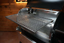 A Pimp My Grill® Gen2 Slide-Out Rack System for the Recteq Flagship 1100 extends horizontally from an open pellet grill.