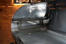 Interior view of a stainless steel Recteq Flagship 1100 featuring the Pimp My Grill® Gen2 Slide-Out Rack System with two horizontal metal slide-out shelves.