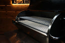 A black Recteq Flagship 1250 pellet grill with its lid open, featuring a Pimp My Grill® Gen2 Slide-Out Rack System with two internal metal wire shelves.