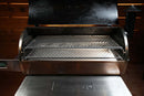 An open Recteq Flagship 1250 grill featuring a Pimp My Grill® Gen2 Slide-Out Rack System with two stacked metal cooking surfaces inside.
