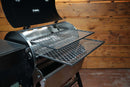 Two metal slide-out rack system grill racks from the Pimp My Grill® Gen2 Slide-Out Rack System - 2 Racks installed in a Recteq Patio Legend 410 pellet grill with the lid open.