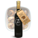 A bottle of Georgetown Olive Oil Co. ROASTED ONION Infused | High Polyphenols Extra Virgin Olive Oil stands in front of a white dish containing roasted onions. The bottle's tag features an image of onions and product details, highlighting its high polyphenols content.