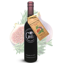 A bottle of Georgetown Olive Oil Co. Rosemary Fig balsamic glaze from Modena, Italy, featuring a labeled tag and set against a backdrop of fresh figs and rosemary sprigs.