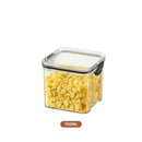 A transparent, square Lovely Home Icon storage box from the 1-4PCS Sealed Jars Kitchen Organizer set, featuring a black latch and filled with cornflakes. The container has a 700ML capacity indicated below.