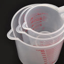 Three PVC measuring cups from Lovely Home Icon, in 250ml, 500ml, and 1000ml sizes, are nested together on a black background. Each features clear volume markings, highlighting the versatility of this essential 3-piece plastic measuring beaker set for accurate ingredient measurement in any kitchen.