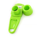 A Lovely Home Icon 1PCS Garlic Crusher Press Multi-Functional Manual Ginger Garlic Grinding Grater Cutter, featuring a green plastic design with a slicer blade, guard, and cap, is shown arranged on a white background—perfect for slicing or grating small foods like garlic or ginger.
