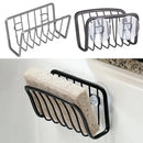 Here’s a rewritten version using your product data: The Lovely Home Icon Sponge Holder For Kitchen Sink, crafted from stainless steel, is shown empty and mounted on the sink with a beige sponge inside. This versatile kitchen organizer doubles as a suction cup sponge caddy, keeping your cleaning essentials neatly arranged and easily accessible.