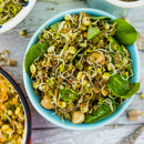 A fresh sprout salad with chickpeas and seeds served in a light blue bowl—perfect for enhancing with SALTOPIA Infused Sea Salts’ Saltopia Low Sodium Salad Seasonings.