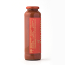 A tall, clear glass jar of Taycte Famiglia Crispino Calabrian Chili Pasta Sauce Starter — Peperoncino, with a red label and orange-red lid, is photographed against a plain white background.