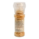 A clear plastic grinder bottle containing light brown chili salt. The label reads "Powerful Pepper Pepper Salt Grinder," an artisan-crafted blend of spicy chili and salt from Powerful Pepper Company—perfect for elevating your favorite foods. Manufacturer details are printed below the description.