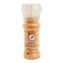 A clear plastic grinder filled with coarse, orange-brown chili salt. The label reads Powerful Pepper Pepper Salt Grinder by Powerful Pepper Company, featuring a red horse logo and net weight 5 oz (142.9g) on the front—an artisan-crafted seasoning perfect for adding bold heat to any dish.