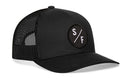The Haka Hat San Francisco Trucker Hat in Black SF X Snapback features a mesh back and a circular patch with white S/F letters—signature HAKA 5.0 style.