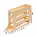 The Lovely Home Icon Refrigerator Egg Storage Box is a beige plastic rack with multiple slots, measuring 33.5 cm in length, 7 cm in width, and 18 cm in height. Featuring four layers and open sides, this automatic rolling egg holder functions as a practical fridge organizer or egg dispenser, providing an efficient solution for storing eggs and organizing your kitchen items.