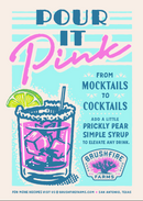 A vibrant ad features a glass filled with a pink drink, ice, a lime wedge, and a straw. The text says: Pour it Pink – From Mocktails to Cocktails. Add a splash of Brushfire Farms Prickly Pear Simple Syrup. The Brushfire Farms logo appears at the bottom.