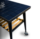 A WPPO LLC Direct black metal Infinity Side Table Long Side 103cm, designed to fit Infinity 50 and 66, featuring a tiled top, wooden slatted shelf, and caster wheels on the legs, displayed on a white background.