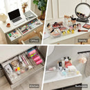 Four organized spaces: an office desk drawer with stationery neatly sorted in the Lovely Home Icon 10-Piece Versatile Drawer Organizer Set—clear plastic trays and dividers in four sizes; a vanity with makeup items arranged in designated compartments; a kitchen drawer divided for tools and utensils; and a bathroom counter where toiletries are kept tidy, each section thoughtfully labeled for effortless organization.